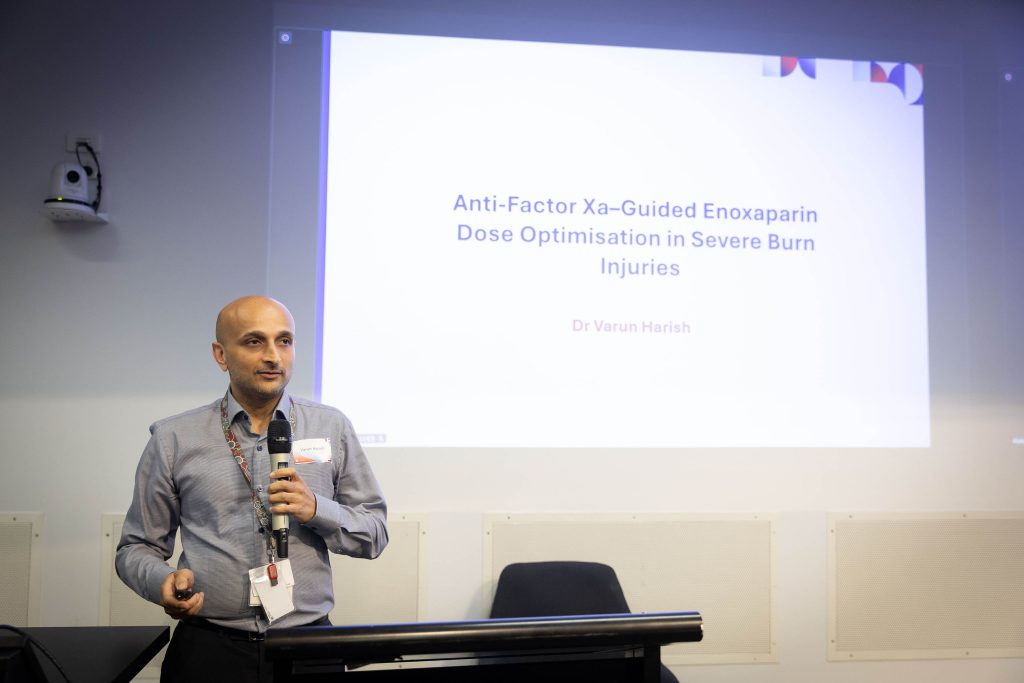 Dr Varun Harish presenting burns and reconstructive surgery research at Royal North Shore Hospital